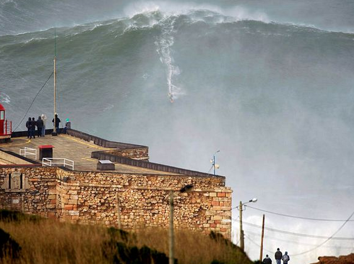 http://www.dailymail.co.uk/news/article-2270128/Garrett-McNamara-The-breathtaking-moment-thrill-seeking-surfer-catches-worlds-biggest-wave-coast-Portugal.html