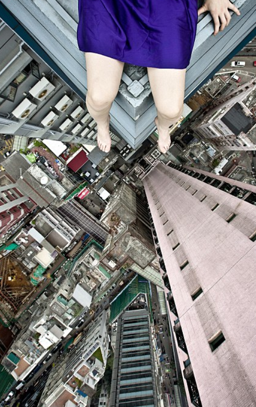 http://www.dailymail.co.uk/news/article-2269568/Woman-ledge-Artist-creates-vertigo-inducing-images-perched-precariously-skyscrapers-world.html
