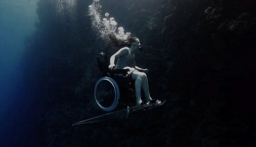 http://abcnews.go.com/blogs/headlines/2013/06/wheelchair-bound-woman-soars-underwater/