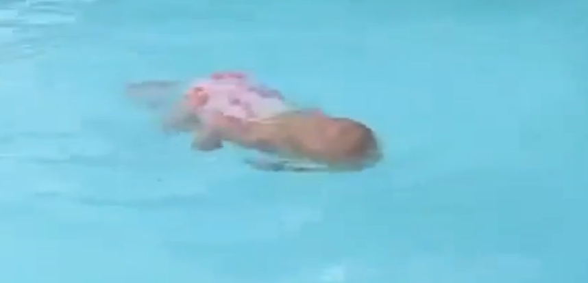 http://www.dailymail.co.uk/news/article-2352477/Incredible-video-shows-baby-swimming-width-pool-breath.html