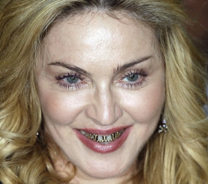 http://www.dailymail.co.uk/tvshowbiz/article-2399456/Madonna-55-shows-gold-grills-pays-visit-Hard-Candy-fitness-studio-Rome.html