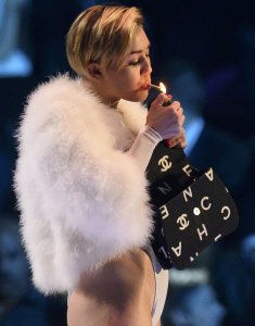http://www.dailymail.co.uk/tvshowbiz/article-2498019/2013-MTV-Europe-Music-Awards-Miley-Cyrus-cements-reputation-bad-girl-pop-thigh-high-boots-VERY-revealing-plunging-top.html