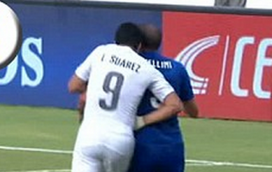 http://www.dailymail.co.uk/news/article-2667460/Hes-Luis-Suarez-bites-opponent-key-World-Cup-clash-against-Italy.html